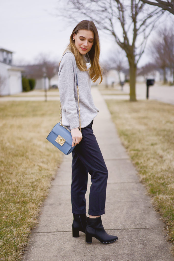 Women's H&M oversized gray turtleneck sweater paired with blue dress pants by the Gap
