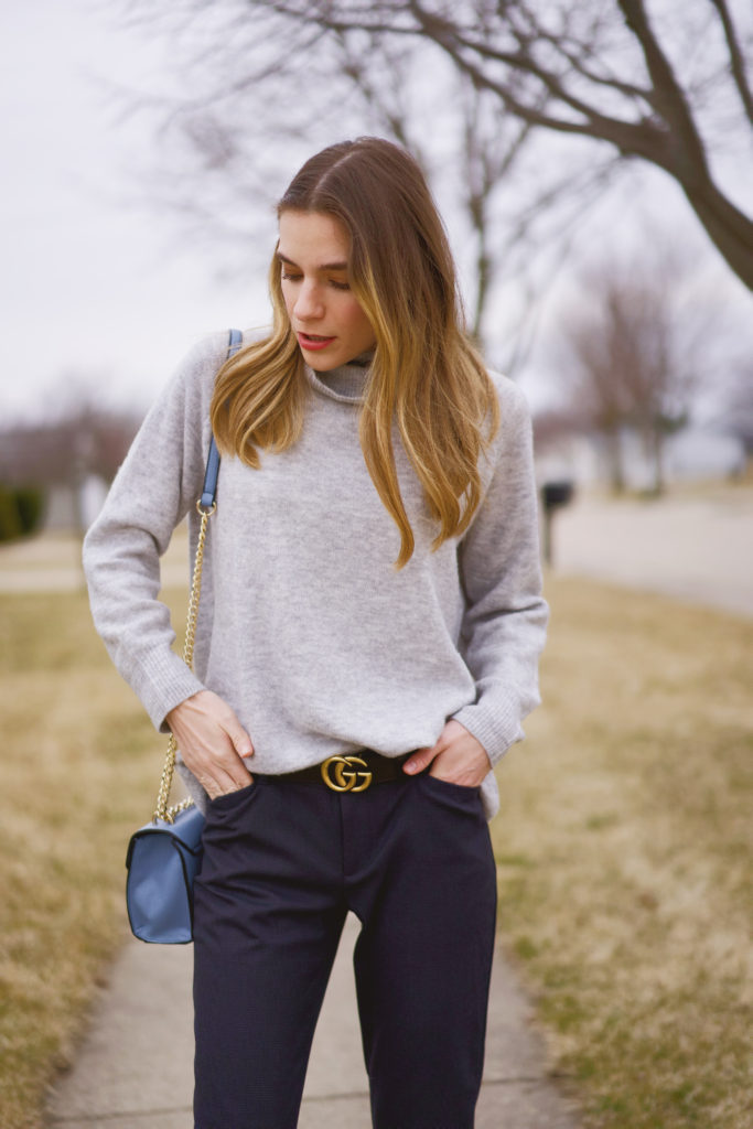 Light gray H&M turtleneck sweater paired with navy blue dress pants by the Gap. 